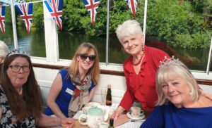 women on boat in red white and blue